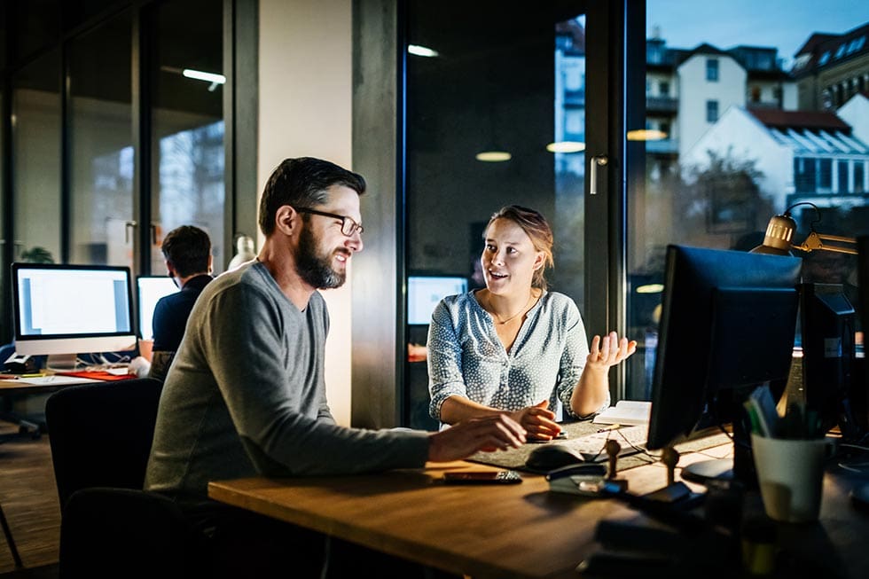 Creative new business people working late on a computer